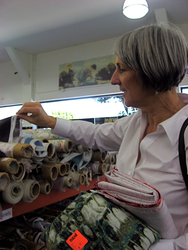 Sandra is captivated by all the luscious fabrics.