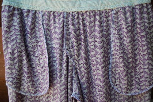 I sewed the seams with my regular machine and then serged them together.