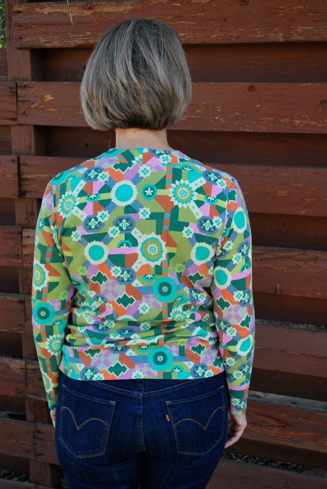 The neckband lays beautifully in the back. The gathers formed by the side shirring are more successful in the back because of the single layer of fabric.